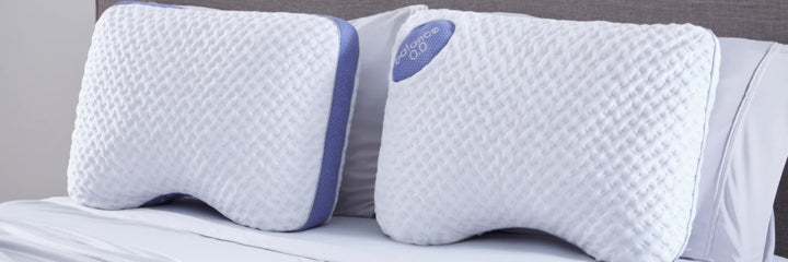 Two Bedgear Balance pillows propped up on a bed